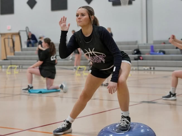 Prime360 athlete holding a lateral lunge on a balance trainer during a conditioning session
